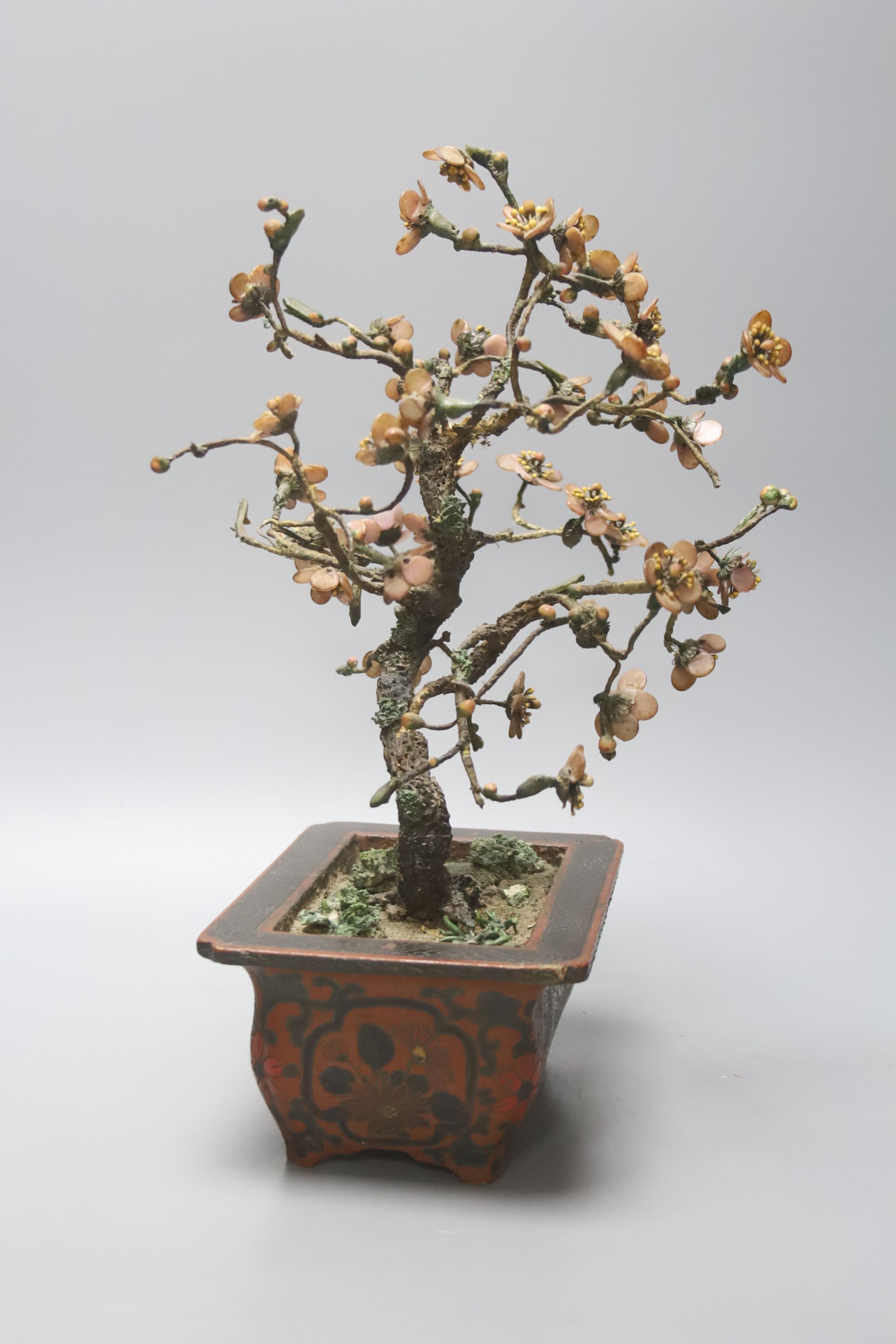 An early 20th century Chinese coloured glass and lacquer model of a tree in a jardiniere 35cm